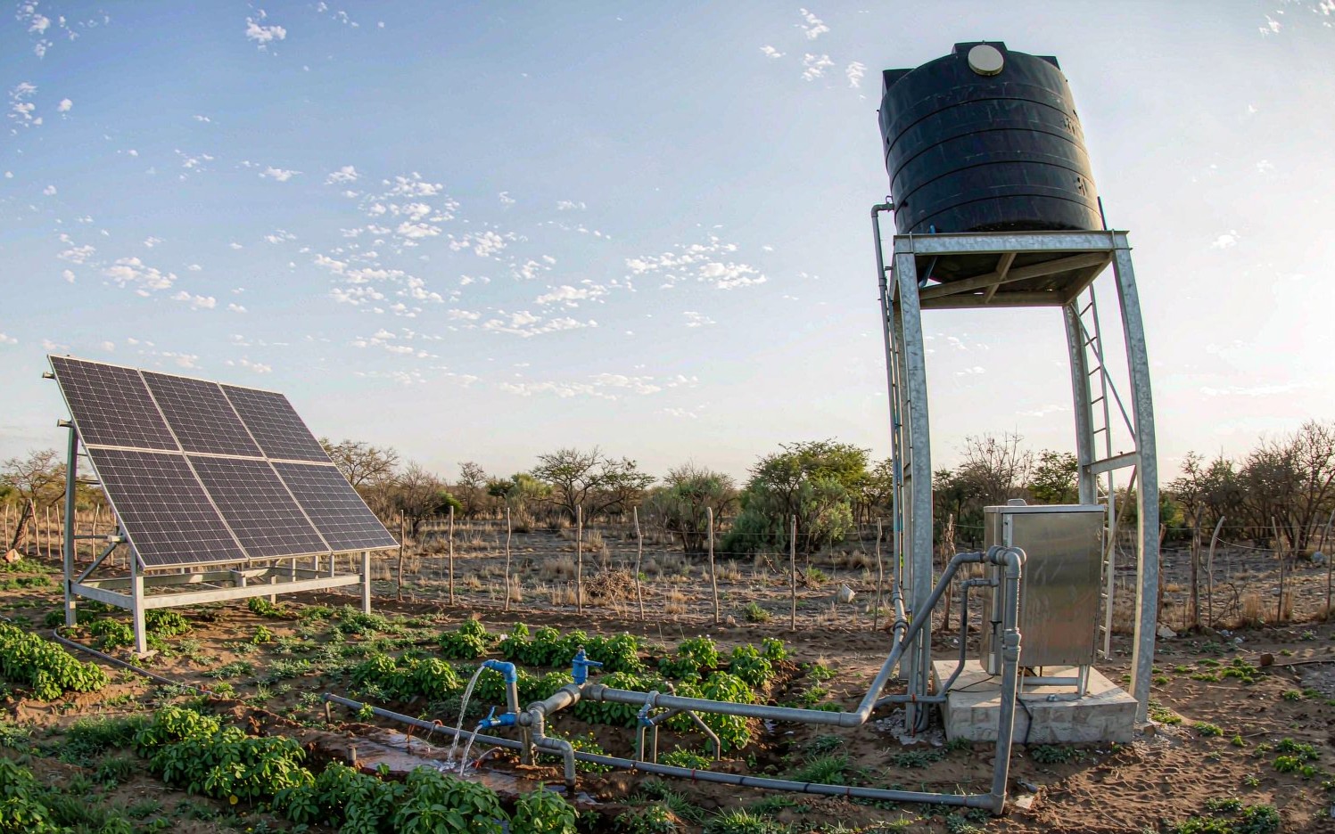 Solar water pump system with PV array and water tank for farm irrigation