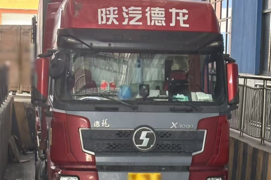 Loaded truck departing the factory with a consolidated solar shipment