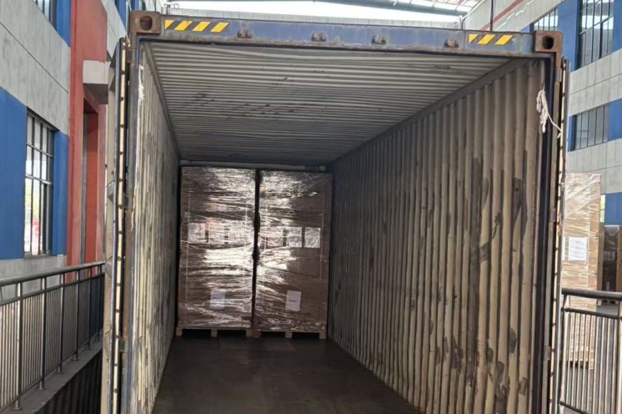 Solar modules and batteries loaded together into one shipping container