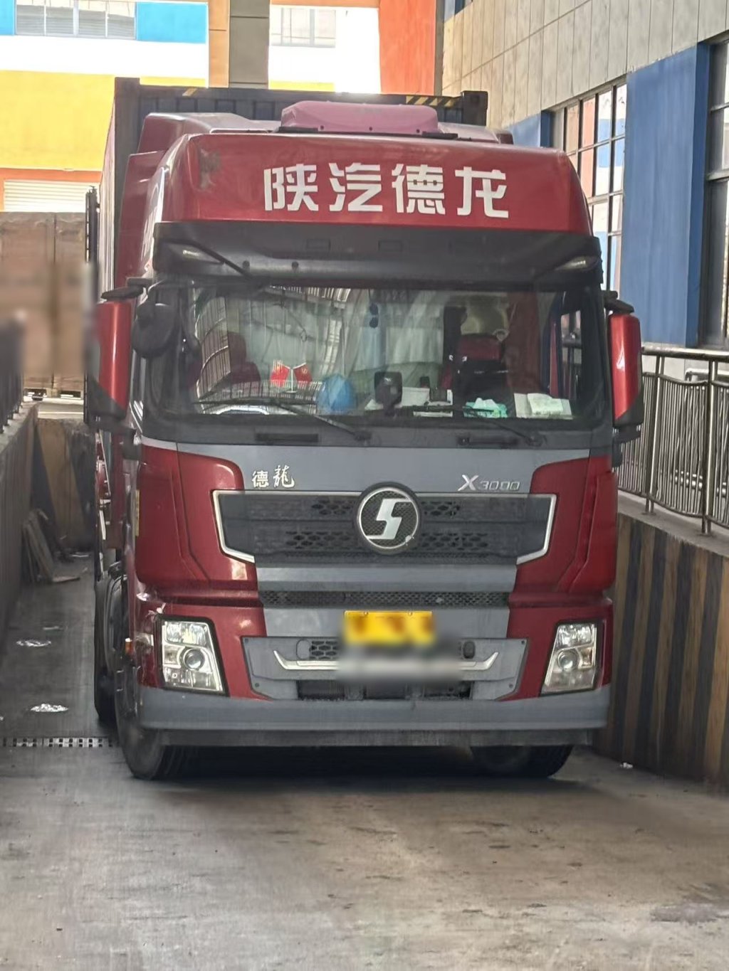 Solar modules loaded onto truck for delivery to port